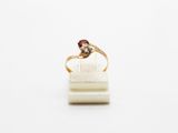 a close up of a ring on a white surface