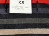 a close up of a striped shirt with a label on it
