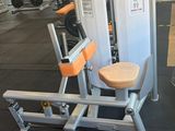 a gym room with machines and other equipment in it