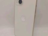 a close up of a white iphone sitting on top of a table