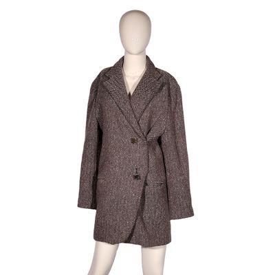 the coat is made of wool and has buttons on the front