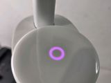 a close up of a toothbrush with a purple ring on it
