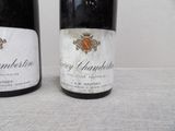 two bottles of wine that are sitting on a table