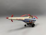 an image of a toy airplane with a propeller on a white surface