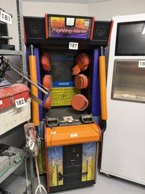 a game machine that is sitting in the corner of a room