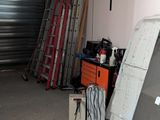 a garage with a lot of junk in it