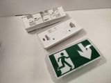 a white box with a green sign and a white box with a green sign and a white box with a green sign and a white box with a green