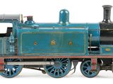 a toy train that is sitting on a white surface