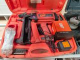 a red tool case with tools in it on a table