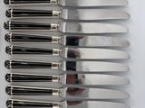 a lot of forks and spoons that are on a table