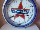 a clock with a star on it sitting on top of a toilet