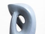 a blue sculpture sitting on top of a white pedestal