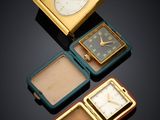 several different types of watches are arranged on a black surface