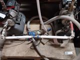 a couple of pipes that are connected to a machine
