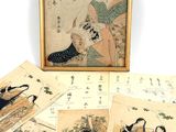 several old japanese paintings are displayed in a wooden frame