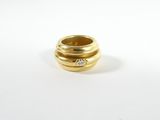 an image of a gold ring with a diamond in the middle