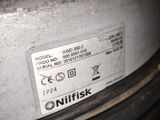 a close up of a metal object with a sticker on it