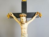 a statue of jesus on a cross on a table