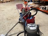 a vacuum that is sitting on the floor in a warehouse