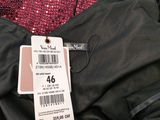 a black jacket with a price tag on it