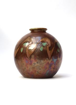 a brown vase with a bird design on it