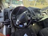 a view of the inside of a car from the driver ' s seat