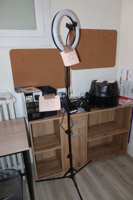 a lamp that is on a stand in the corner of a room