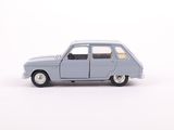 a small toy car that is sitting on a white surface