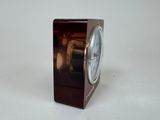 a small clock that is sitting on a table