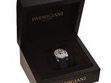 a close up of a watch in a black box on a white background