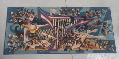 a rug with a picture of a woman playing a harp