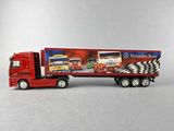 a toy truck with a mercedes - benz advertisement on the back