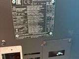 the back panel of a machine with a lot of buttons on it
