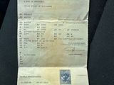 a receipt sitting on the seat of a car