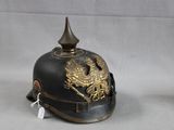 a black helmet with a gold dragon on it