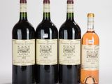 trois bouteilles de vin sont posées les unes à côté des autres sur une surface blanche