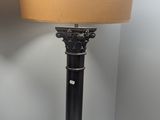a lamp that is sitting on a table with a lamp on it