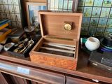 a wooden box on a table with a clock on top of it