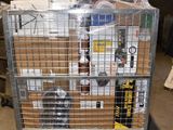 a metal cage with a bunch of items on top of it
