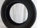 a close up of a tire on a white surface with a white background