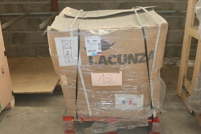 a cart with a box on it in a warehouse