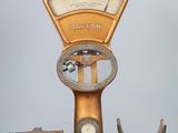 a scale that is sitting on top of a wooden table