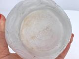 a person holding a glass of water in their hand