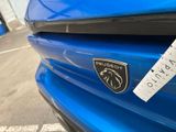 a sticker on the hood of a blue sports car