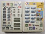 a book with stamps on the pages and a picture of a train