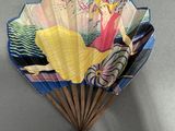 a fan that has a picture of a woman on it