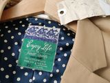 a close up of a suit and tie on a hanger