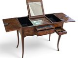 an image of a desk with a mirror on top of it