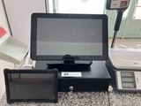 a picture of a cash register machine with a tablet on it