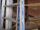 a ladder that is leaning up against a brick wall
